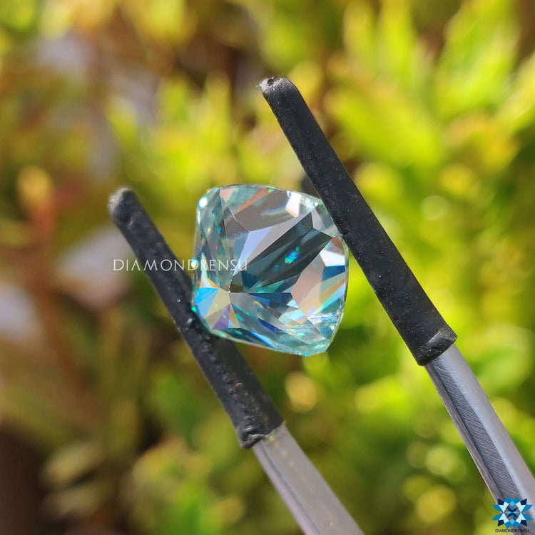 Loose moissanite shown in brilliant cushion style.