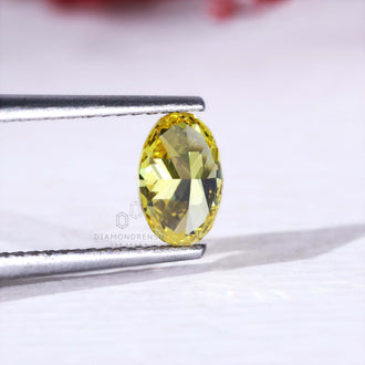IGI certified loose oval yellow diamond lab grown.