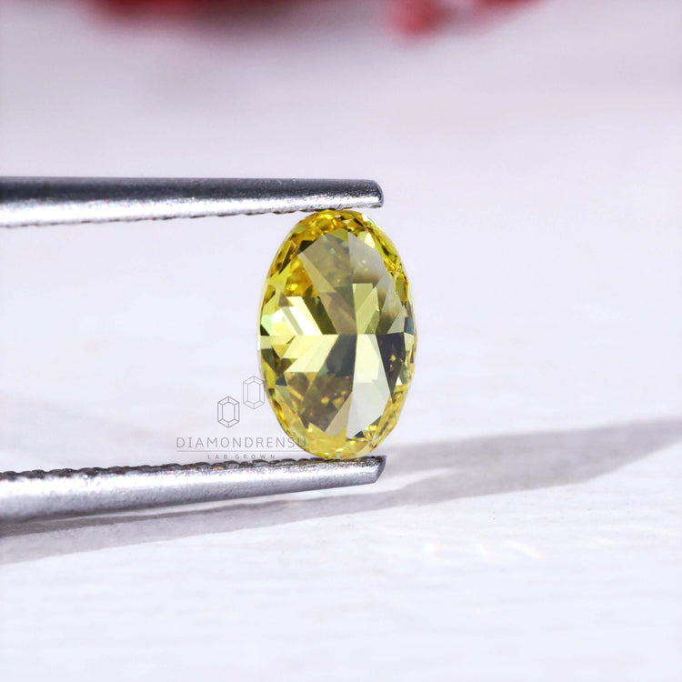 IGI certified loose oval yellow diamond lab grown.