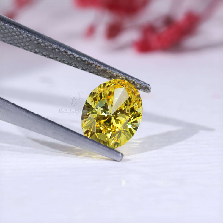 Lab grown yellow loose oval diamond certified.