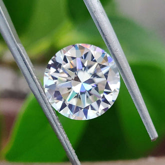 Round Cut Hearts and Arrows shown as a loose moissanite from Diamondresnu.