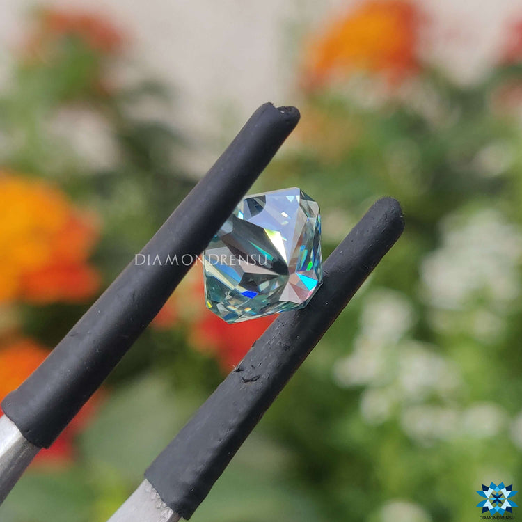 1.65 carat moissanite sold as radiant cut moissanite and cyan blue moissanite.