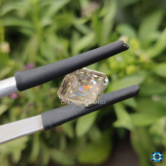 Off white moissanite offered in an asscher cut shape.