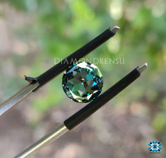 Aqua green stone shown as round rose cut moissanite, perfect in 2 carat moissanite size.