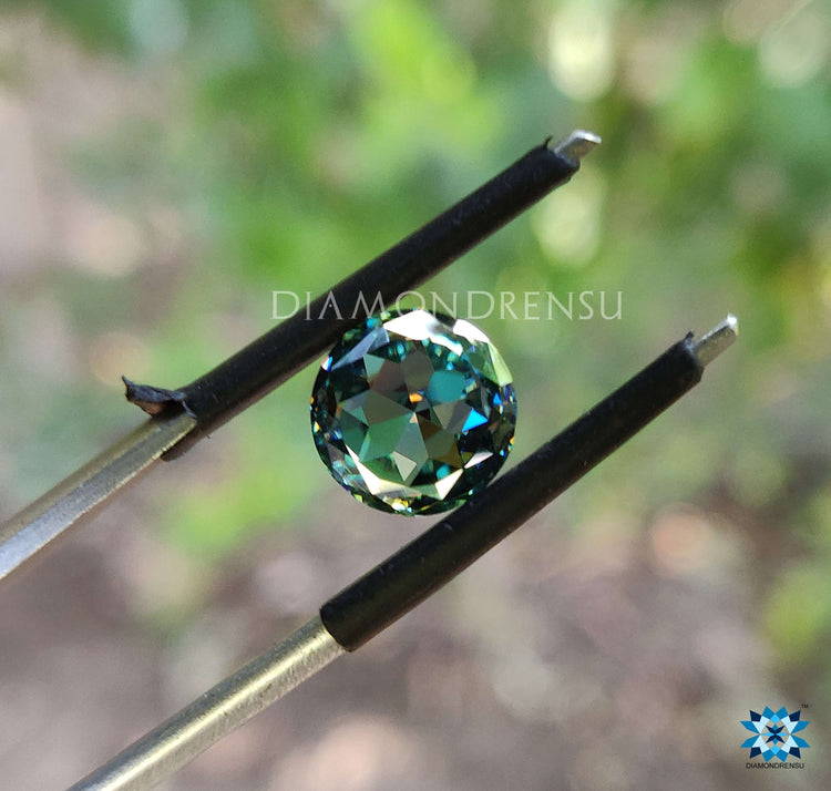 Aqua green stone shown as round rose cut moissanite, perfect in 2 carat moissanite size.