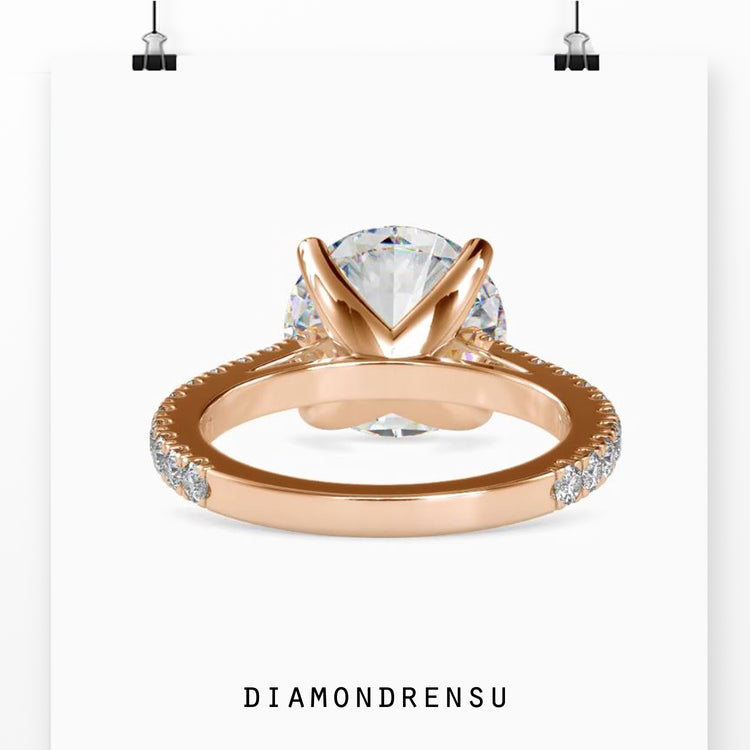 Pave ring setting with a 4 prong engagement ring design and a cathedral setting for added elegance.