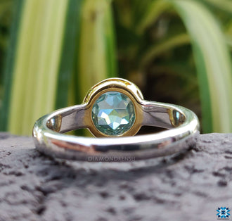 A luxurious two-tone solitaire engagement ring blending white and yellow gold for a contemporary look.