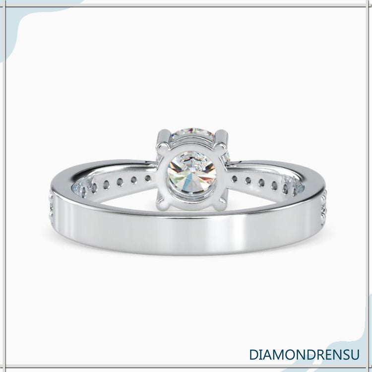Lab grown diamond ring with a 2 carat round cut diamond and basket setting for extra elegance.