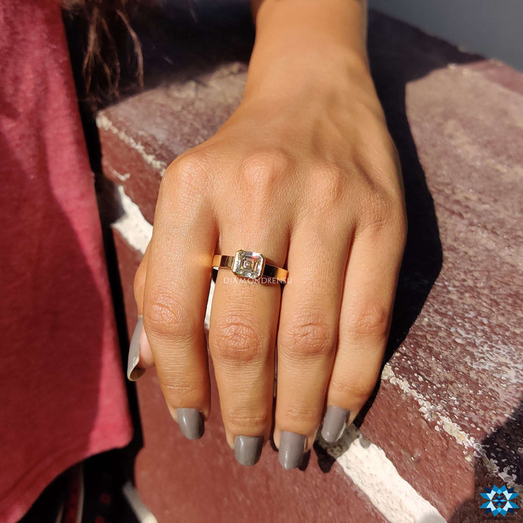 A gold solitaire engagement ring combining elegance with a warm golden hue.