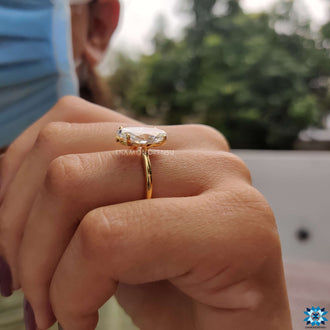 Sleek and stylish moval ring for a modern engagement look.