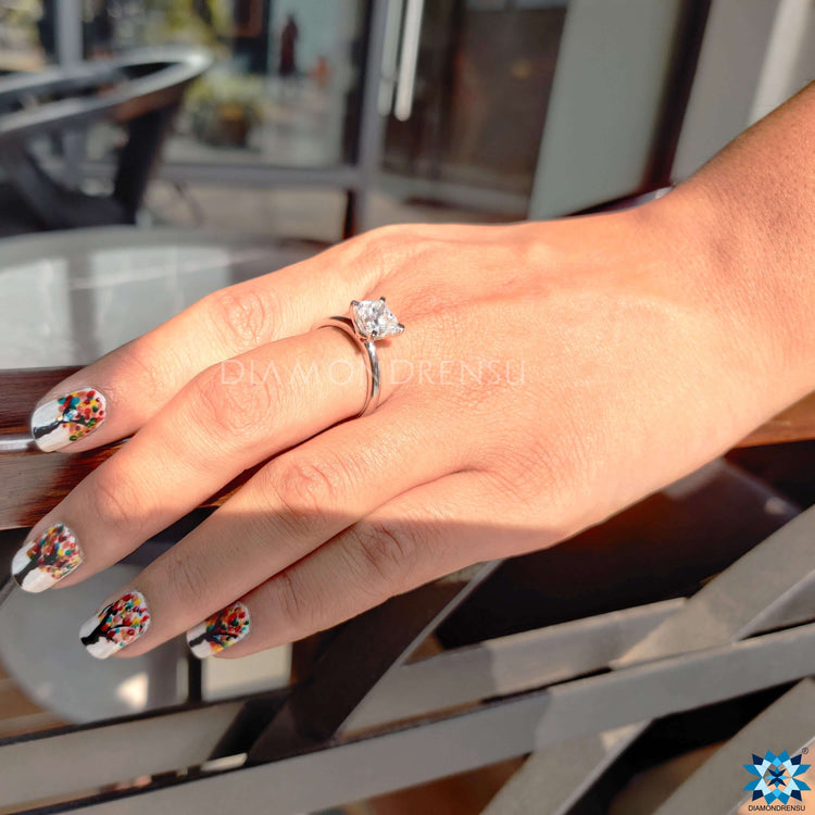 Prong setting cushion cut engagement ring for a secure and elegant look.