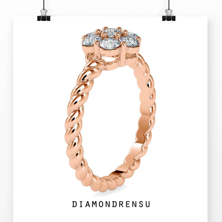 Round diamond engagement ring in rose gold with a cluster setting