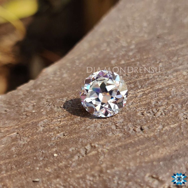 Colorless round moissanite in old European cut crafted as a loose stone.