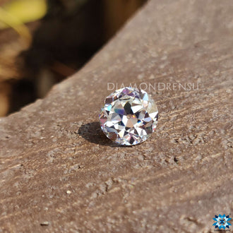 Colorless round moissanite in old European cut crafted as a loose stone.