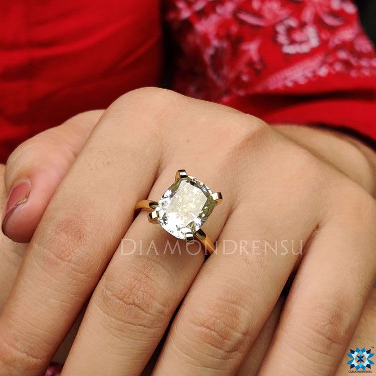 Cushion solitaire engagement ring designed for everlasting love.