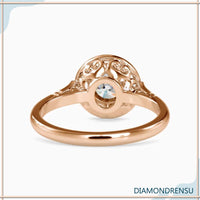 Round engagement ring in a cathedral setting for a vintage-inspired look.