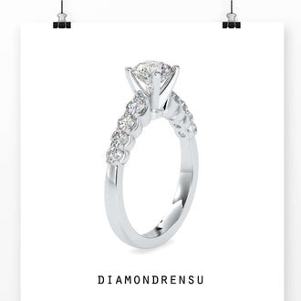 Engagement ring with pave stones surrounding the round diamond for added brilliance.