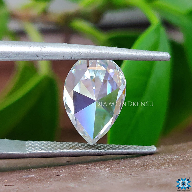 Buy moissanite stone in Antique cut to create custom pear rose cut earrings.