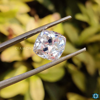 Moissanite loose stone shaped in cushion cut with 1.5 carat weight and soft edges.