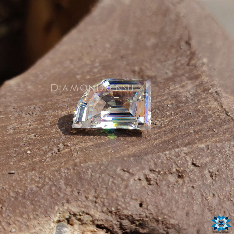 Moissanite loose stone in 6.57 carat elephant tooth cut with a near colorless antique look.