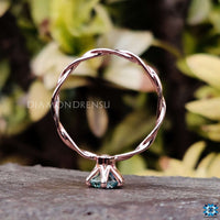 Twisted solitaire engagement ring with intricate craftsmanship for her.