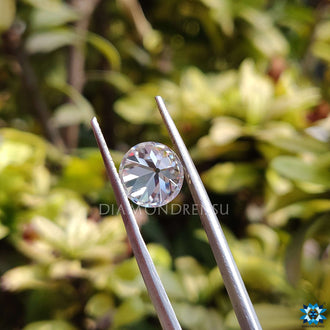 Antique cut moissanite loose stone in OEC round shape with clear colorless appearance.