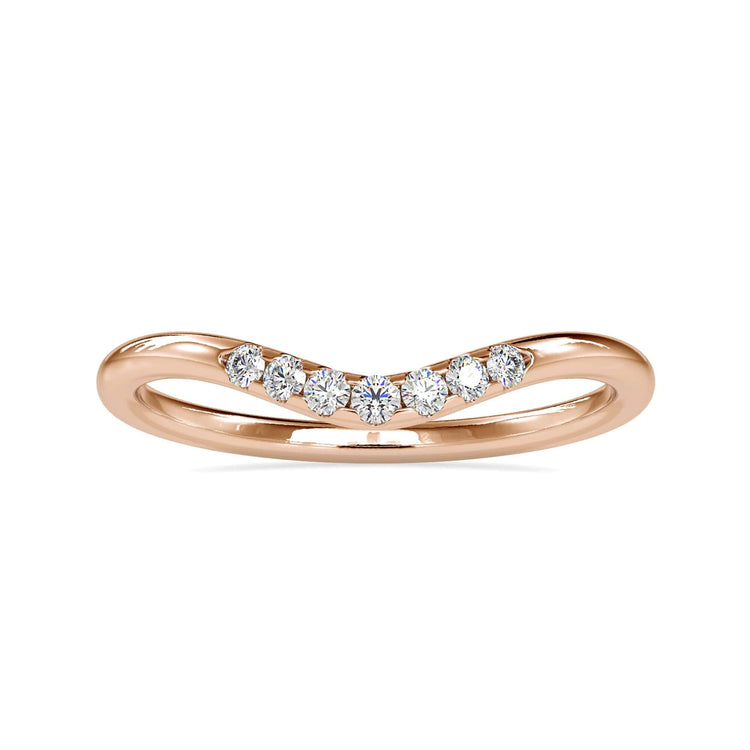Curved diamond wedding band in rose gold with sparkling accents