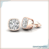 Radiant diamond cushion earrings set in a classic bezel stud earring design.