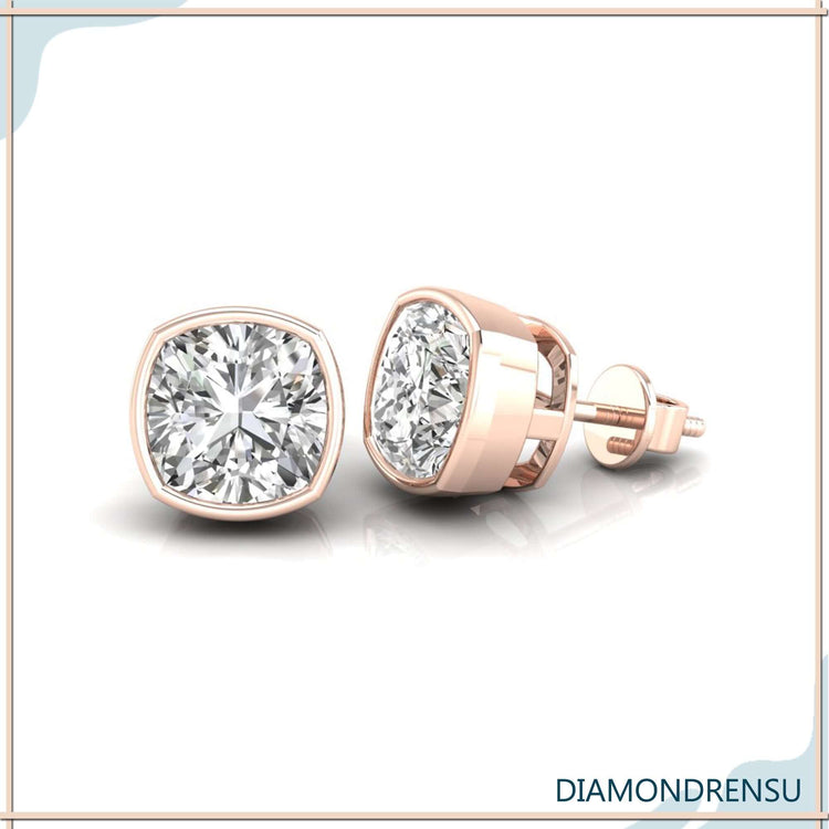 Radiant diamond cushion earrings set in a classic bezel stud earring design.