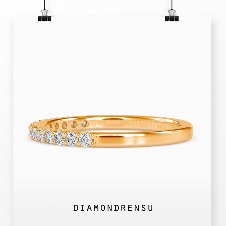 Shared prong eternity band with a white gold wedding band design.