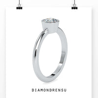 Beautiful bezel setting ring with a single diamond for a minimalist look.