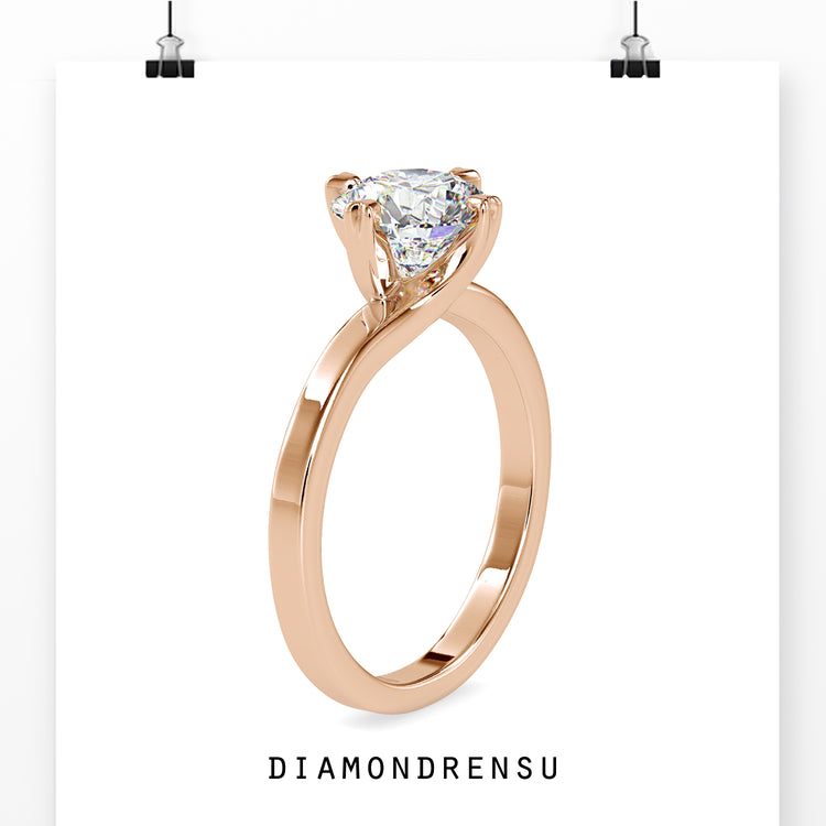 Solitaire engagement ring available in rose gold, white gold, or yellow gold.