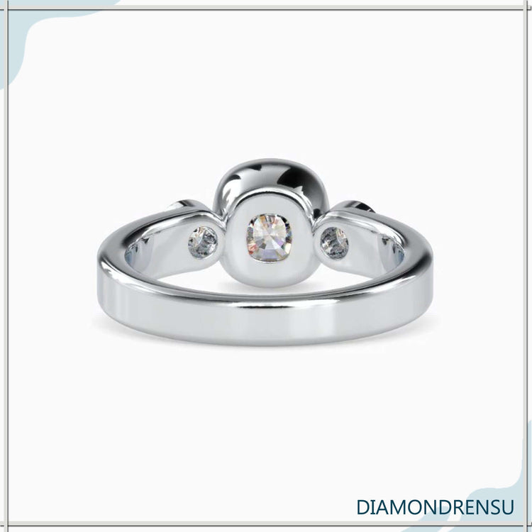 Three stone emerald cut diamond ring in yellow gold, a stunning vintage-inspired piece.