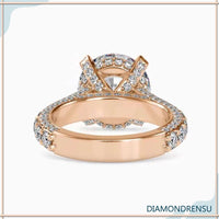 Pave diamond ring band with side stone engagement accents.