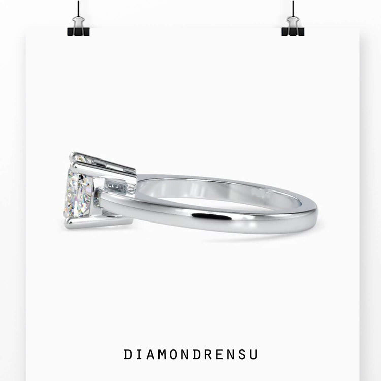 Solitaire diamond ring with a cushion cut design for timeless elegance.