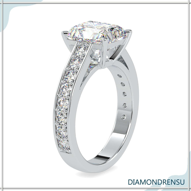A radiant moissanite engagement ring paired with a channel set engagement ring band for a modern look.