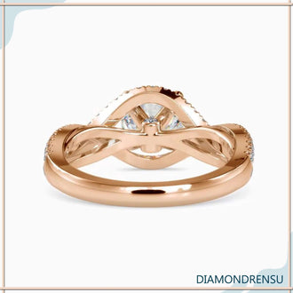 Unique engagement ring design with a twisted ring and a round brilliant cut diamond.