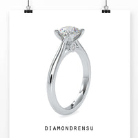 Diamondrensu round diamond engagement ring with a cathedral setting, blending vintage elegance with modern craftsmanship.