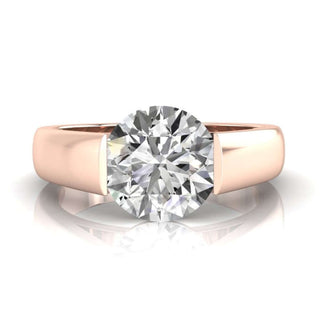 Mens gold wedding band with round brilliant cut diamond accents.