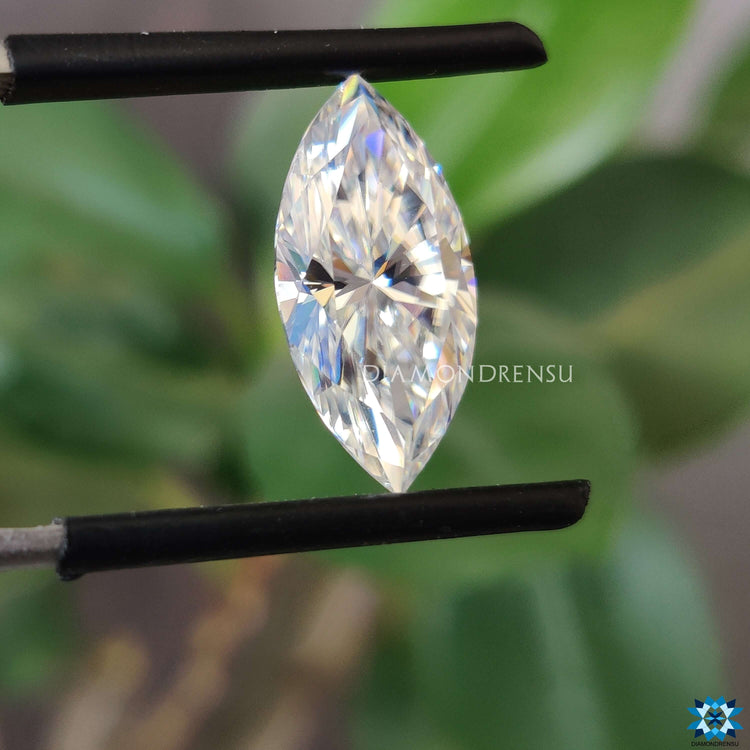 Colorless marquise shape loose stone with radiant moissanite.