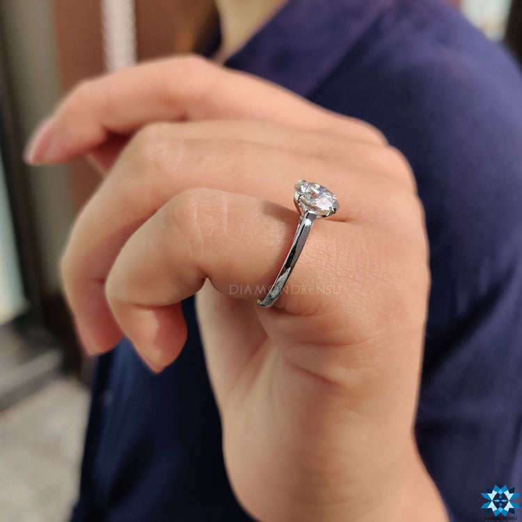 Round engagement ring designed to capture life's precious moments.