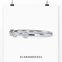 Handmade bezel set eternity band with round diamonds in rose gold