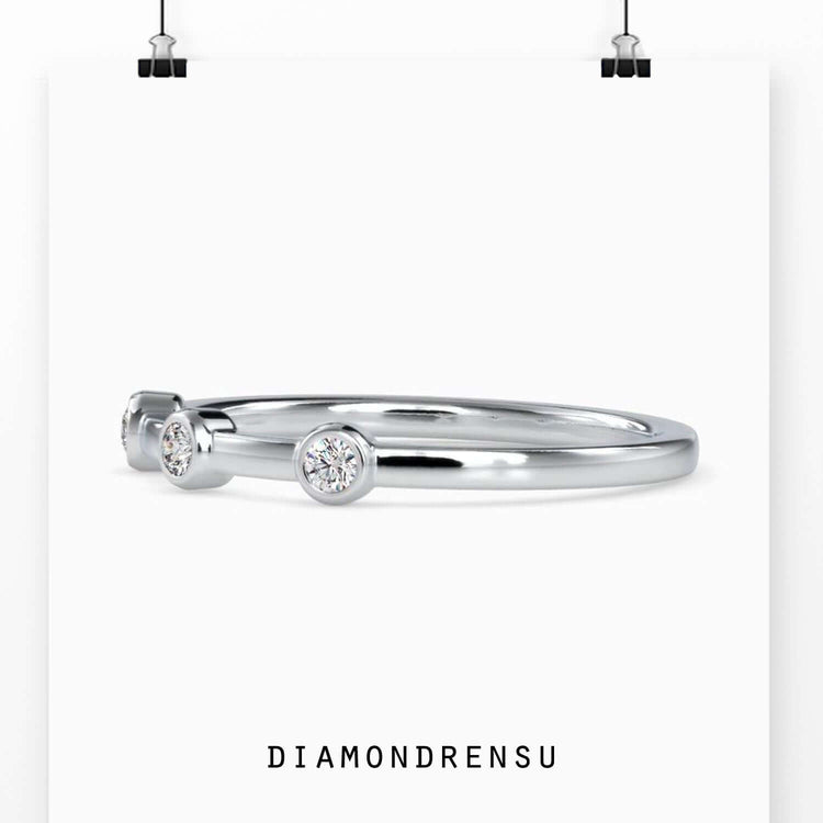 Handmade bezel set eternity band with round diamonds in rose gold