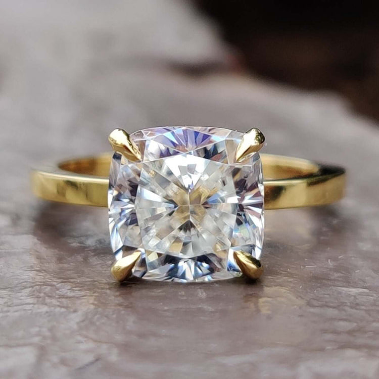 A stunning cushion cut ring with a classic design, perfect for timeless elegance.