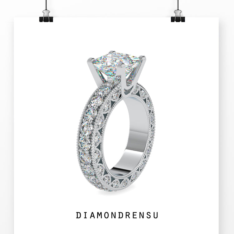 Pave setting ring featuring a princess cut diamond and a unique design.