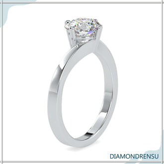 Classic round diamond ring in a bypass setting with basket details.