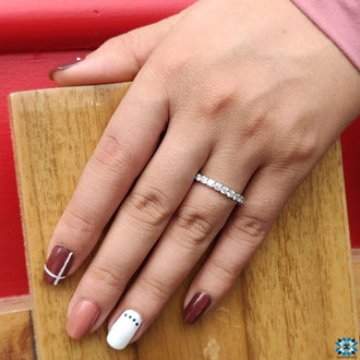 Round cut eternity band with dazzling moissanite stones.