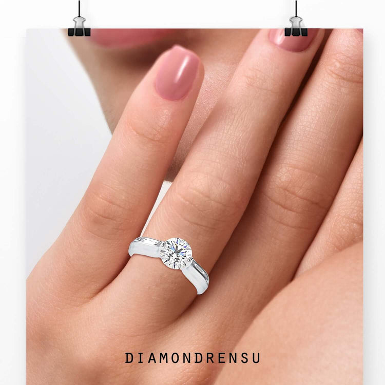 Handmade tension set ring with IGI certified diamond.