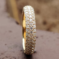 Pave wedding band featuring intricate and elegant design.