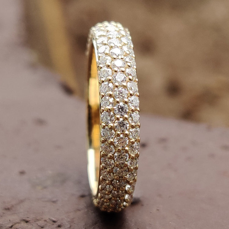 Pave wedding band featuring intricate and elegant design.